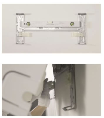 Mounting plate with two flaps allowing spacing from the wall for better interior cable management